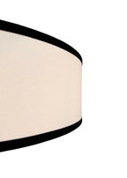 Side view of Haven Flush Mount linen drum shade with black edge