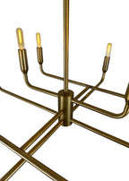 Close-up of Mercer Chandelier aged brass finish and curved steel arms