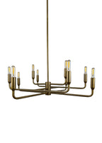 Close-up of Mercer Chandelier aged brass finish and curved steel arms