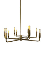Close-up of Mercer Chandelier aged brass finish and curved steel arms