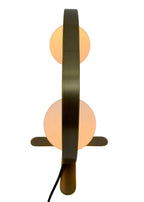 Back view of Orbit Table Lamp with circular brass frame and glass globes