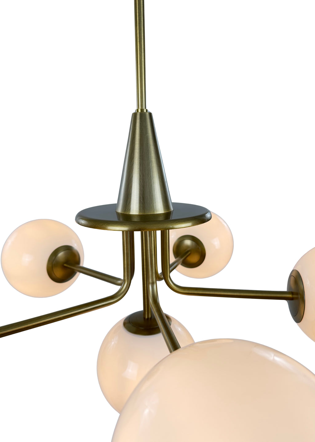 Close-up of Orion Chandelier aged brass frame and milk glass shade