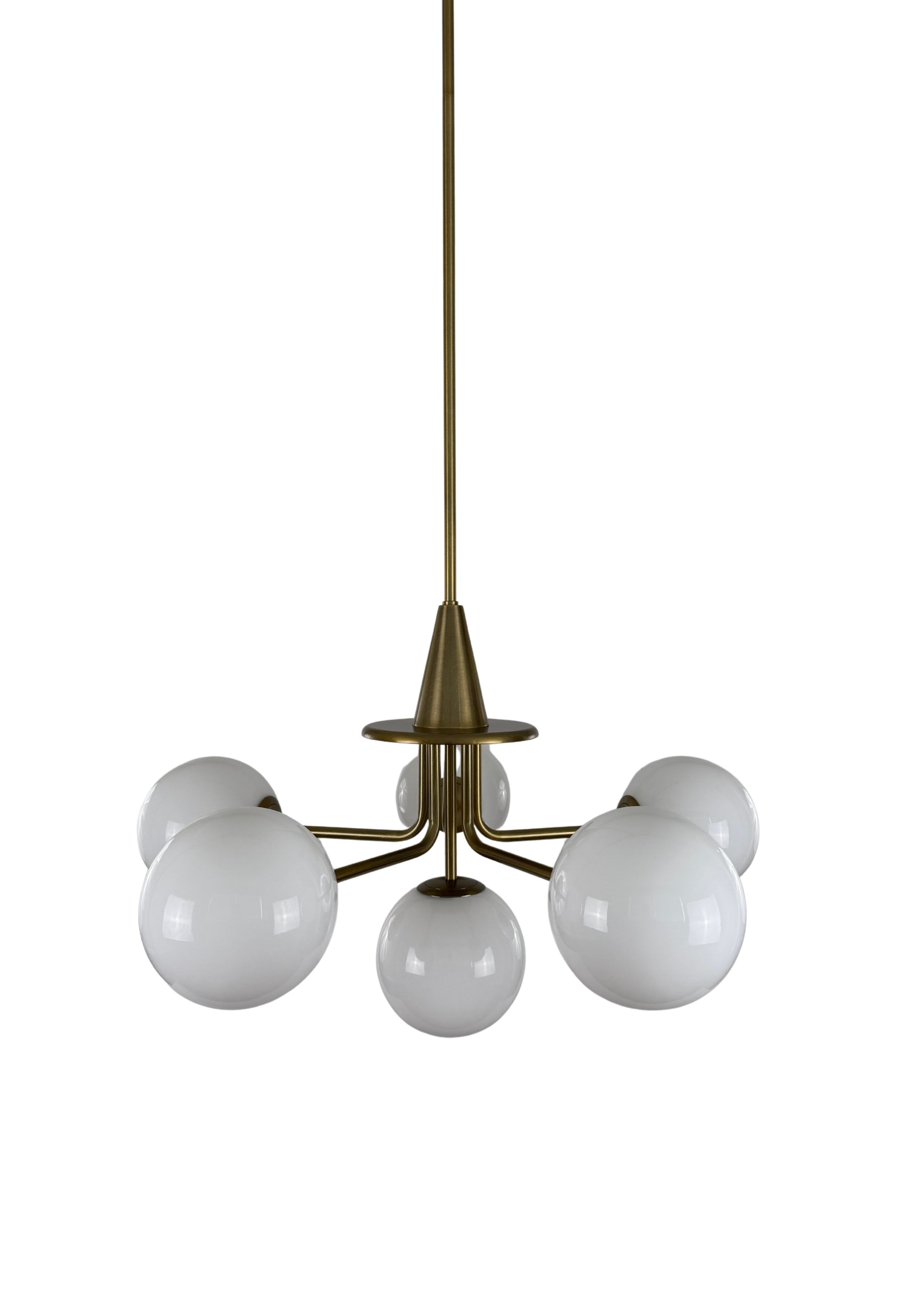 Close-up of Orion Chandelier aged brass frame and milk glass shade